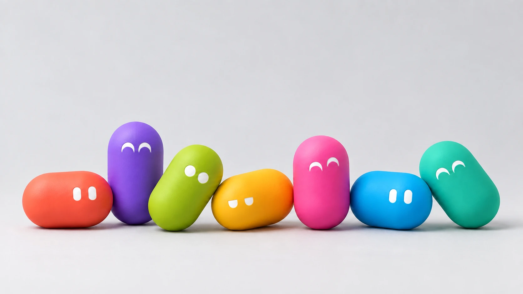 Seven pills of different colors in a row, standing, lying and leaning like a group photo.
